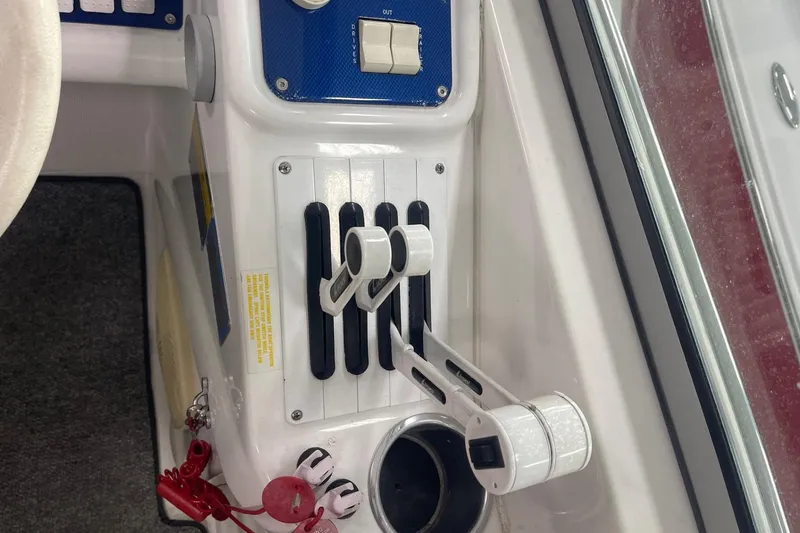 Slide: The Image of 2005 Formula 292 FASTech boat controls with throttle levers and switches. - 15