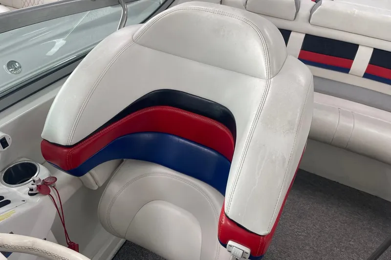 Slide: The Image of 2005 Formula 292 FASTech boat interior with red, blue, and white seating. - 16
