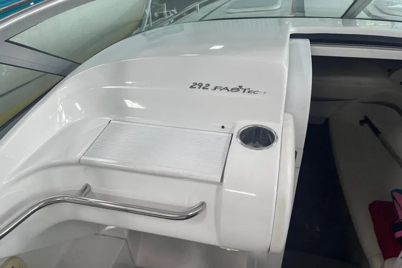 Slide: The Image of 2005 Formula 292 FASTech boat interior with sleek white design and stainless steel accents. - 18