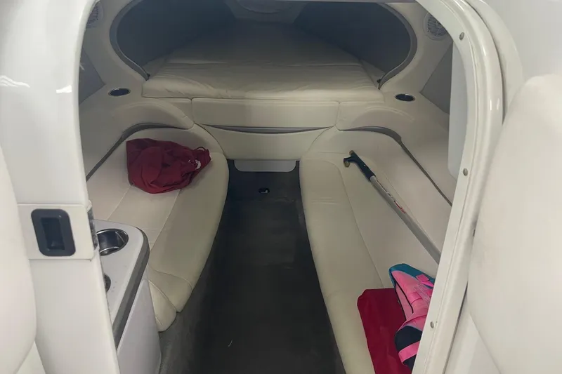 Slide: The Image of Interior cabin of a 2005 Formula 292 FASTech boat with white seating and storage. - 19
