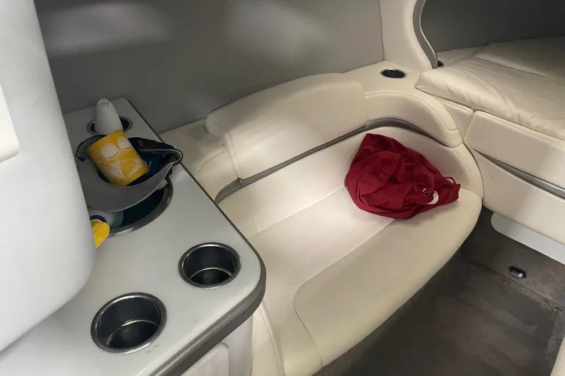 Slide: The Image of Interior of 2005 Formula 292 FASTech boat with white seating and cup holders. - 21