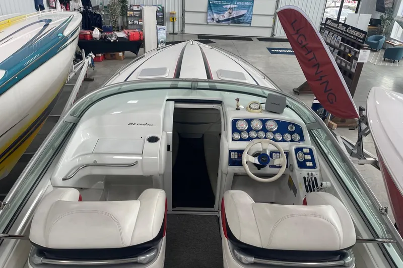Slide: The Image of 2005 Formula 292 FASTech boat interior with dashboard and seating in showroom. - 3