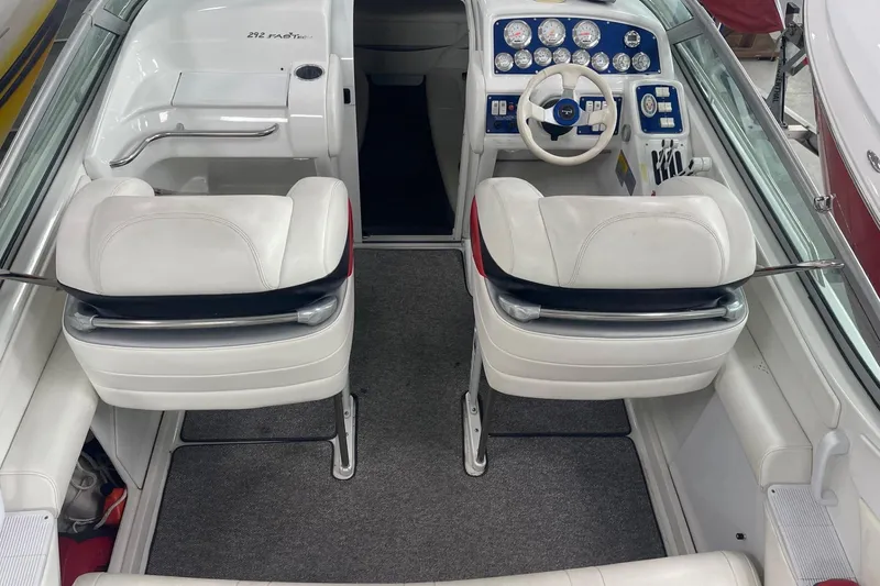 Slide: The Image of 2005 Formula 292 FASTech boat interior with white seating and detailed dashboard. - 4