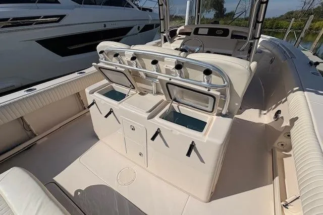 Slide: The Image of 2013 Grady-White Canyon 336 boat interior with open storage compartments. - 12