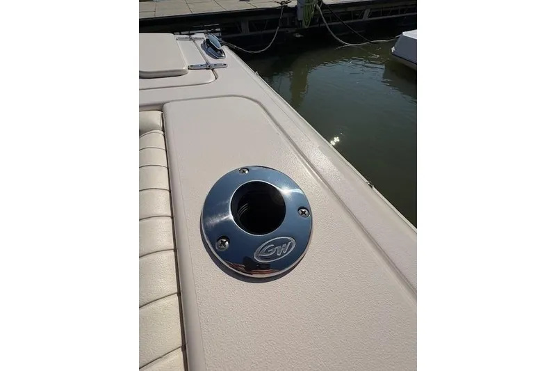 Slide: The Image of 2013 Grady-White Canyon 336 boat detail with chrome rod holder by the water. - 13
