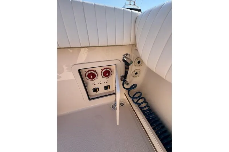 Slide: The Image of Control panel and hose on 2013 Grady-White Canyon 336 boat. - 14