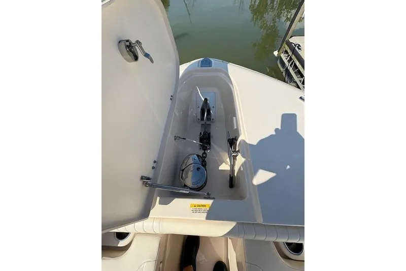 Slide: The Image of Open anchor compartment on 2013 Grady-White Canyon 336 boat, showing anchor mechanism. - 26