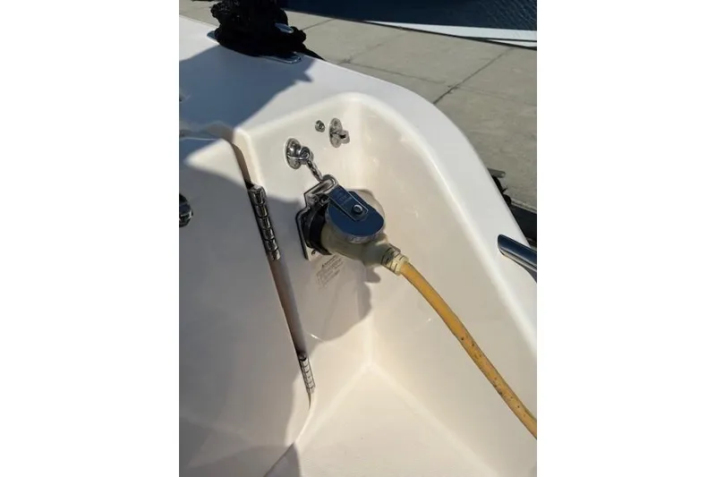 Slide: The Image of 2013 Grady-White Canyon 336 boat with a yellow power cable connection. - 30