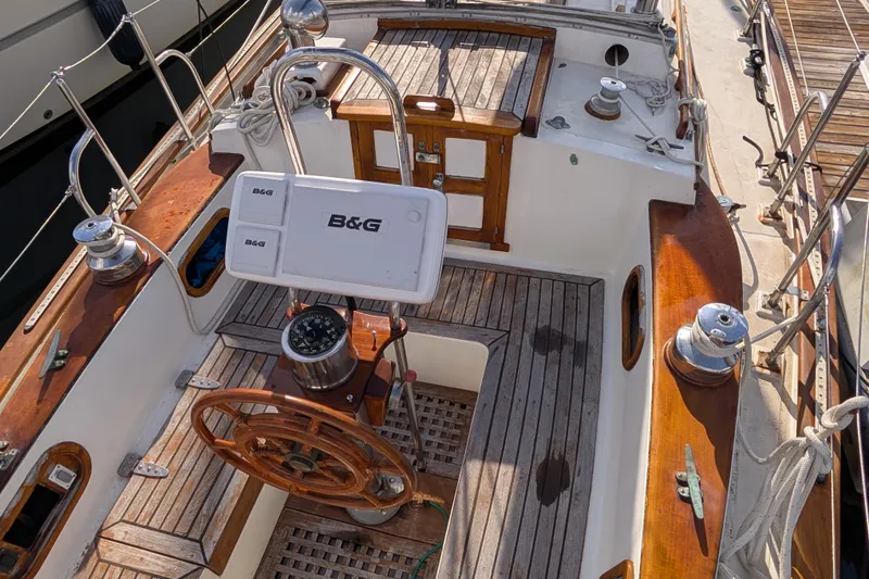 Slide: The Image of Cockpit of 1983 Robert Perry 41 sailboat with wooden accents and B&G navigation equipment. - 30