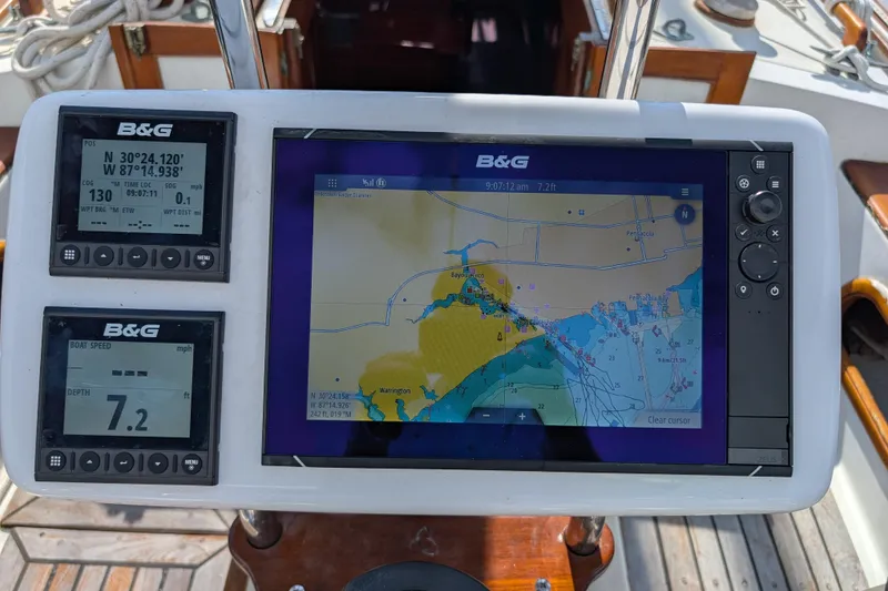 Slide: The Image of Navigation system on a 1983 Robert Perry 41 sailboat, displaying maps and coordinates. - 33