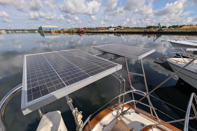 Slide: The Image of Sailboat with solar panels on calm water, Robert Perry 41, 1983 model. - 37
