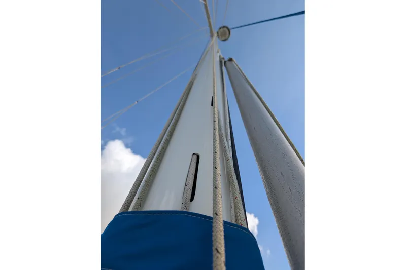 Slide: The Image of Mast and rigging of 1983 Robert Perry 41 sailboat against blue sky. - 47