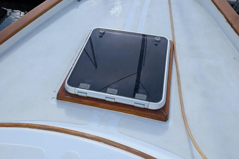 Slide: The Image of Hatch on deck of 1983 Robert Perry 41 sailboat, featuring wooden trim. - 49