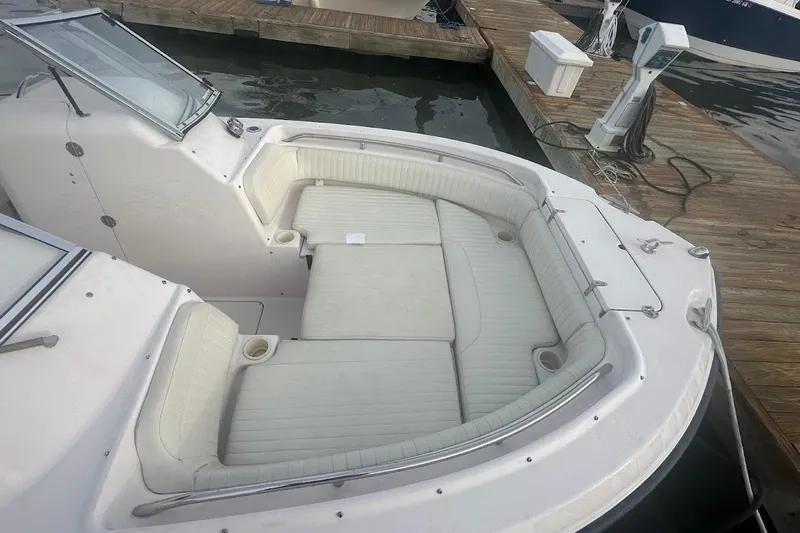 Slide: The Image of 2004 Grady-White Tournament 225 boat with spacious seating at dock. - 13