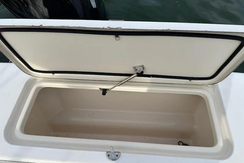 Slide: The Image of Open storage compartment on 2004 Grady-White Tournament 225 boat. - 25