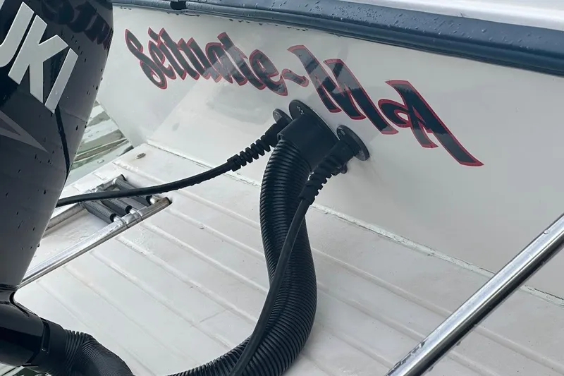 Slide: The Image of 2004 Grady-White Tournament 225 boat with Suzuki engine, close-up view. - 26