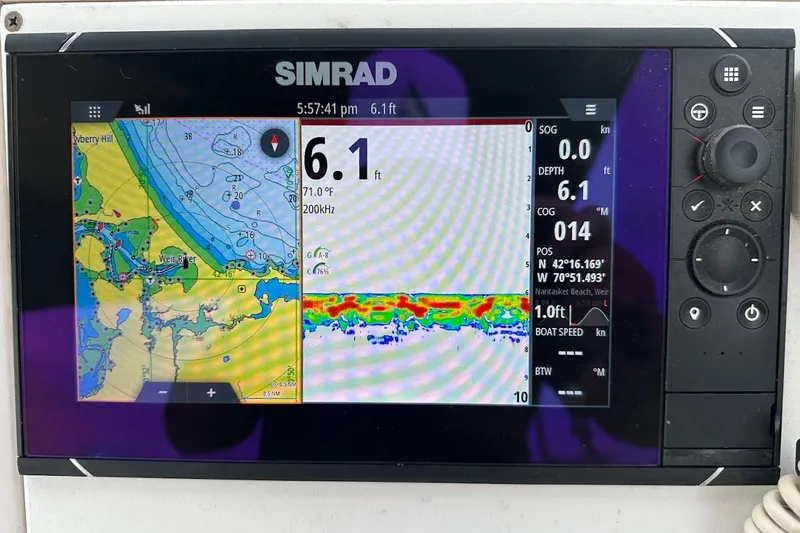 Slide: The Image of Simrad marine GPS display on 2004 Grady-White Tournament 225 boat, showing depth and navigation data. - 5