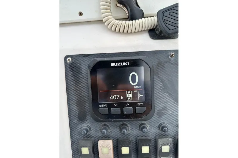 Slide: The Image of Suzuki engine display on 2004 Grady-White Tournament 225 boat dashboard. - 6