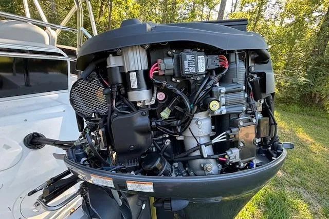 Slide: The Image of Outboard motor of 2025 Hurricane FunDeck 198 RE OB, detailed view in a natural setting. - 11