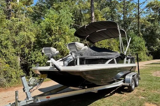 Slide: The Image of 2025 Hurricane FunDeck 198 RE OB boat on trailer, parked outdoors with canopy. - 4