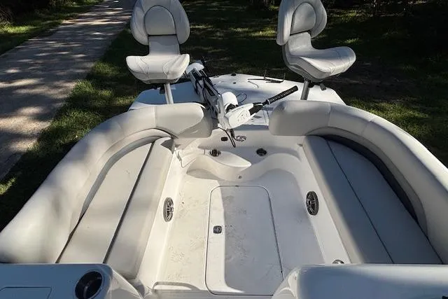 Slide: The Image of 2025 Hurricane FunDeck 198 RE OB boat interior with seating and steering console. - 8