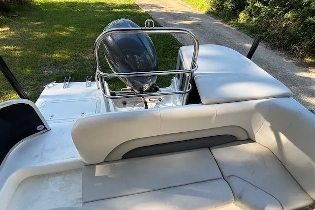 Slide: The Image of 2025 Hurricane FunDeck 198 RE OB boat interior with seating and outboard motor. - 9