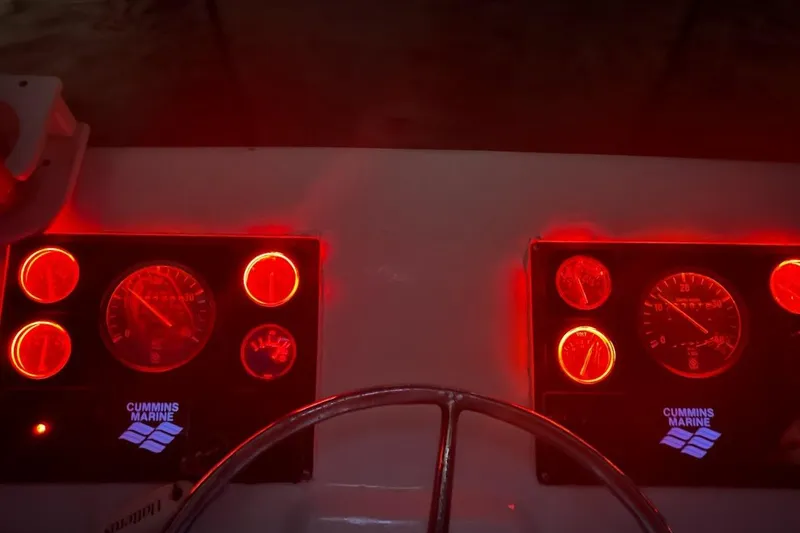 Slide: The Image of Red-lit dashboard of a 1963 Hatteras 34 Convertible boat with Cummins Marine gauges. - 12