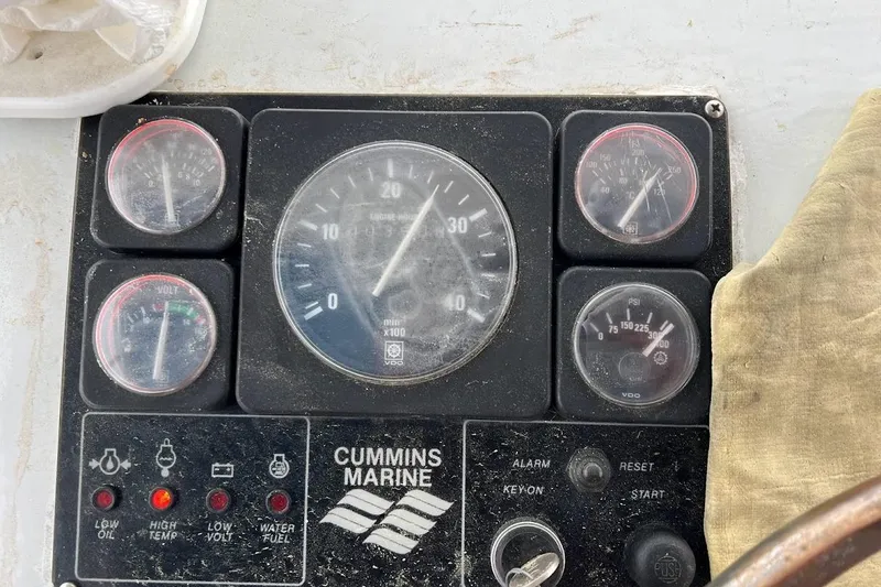 Slide: The Image of Engine compartment of a 1963 Hatteras 34 Convertible boat, showcasing mechanical components. - 21