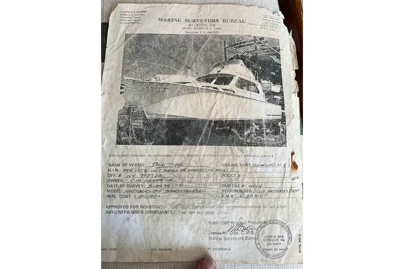 Slide: The Image of 1963 Hatteras 34 Convertible marine survey document with vessel image and details. - 33