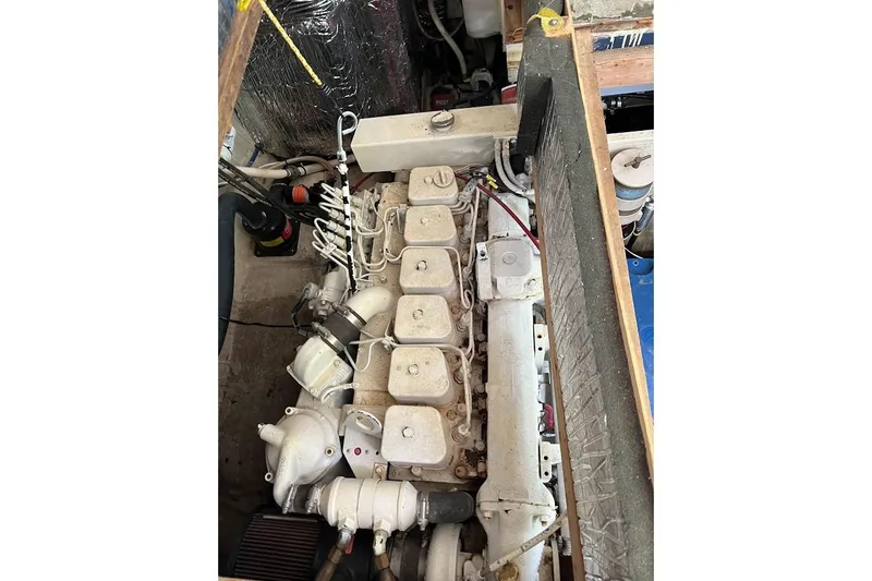 Slide: The Image of 1963 Hatteras 34 Convertible engine compartment with visible components and wiring. - 37