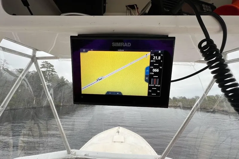 Slide: The Image of Simrad navigation display on 1963 Hatteras 34 Convertible boat, showing speed and depth. - 22