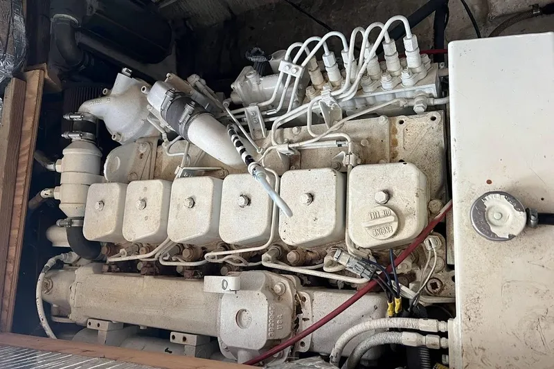 Slide: The Image of Engine of a 1963 Hatteras 34 Convertible boat, showcasing intricate mechanical components. - 36