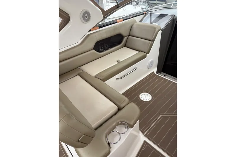 Slide: The Image of 2010 Regal 3360 Window Express interior with beige seating and wood-patterned flooring. - 15