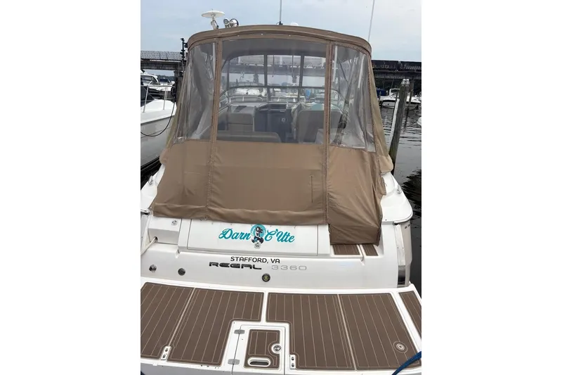 Slide: The Image of 2010 Regal 3360 Window Express boat with tan canopy, docked in Stafford, VA. - 3