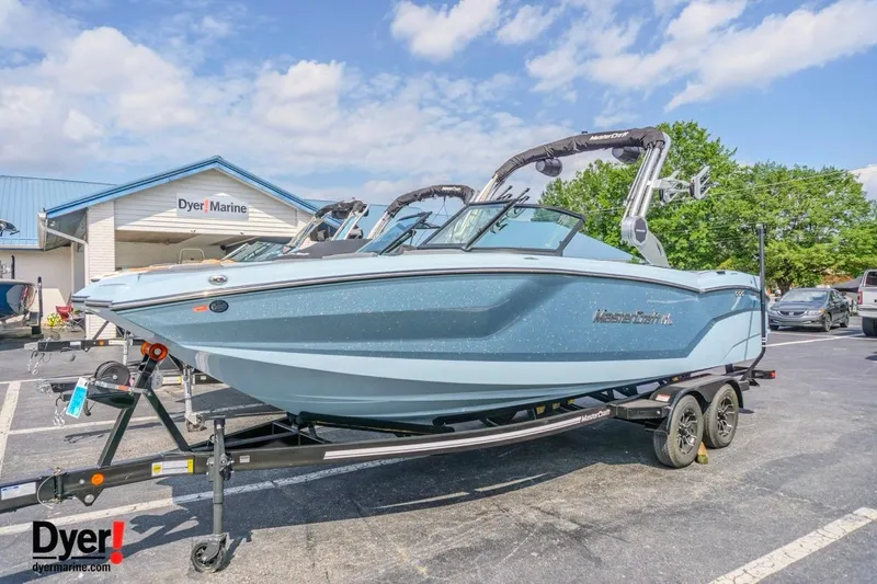 Slide: The Image of 2026 MasterCraft NXT24 boat on trailer at Dyer Marine dealership. - 5