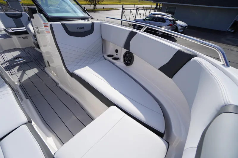 Slide: The Image of 2026 Chaparral 250 OSX boat interior with sleek white seating and modern design. - 10