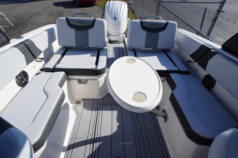 Slide: The Image of 2026 Chaparral 250 OSX boat interior with seating and table, showcasing modern design. - 38