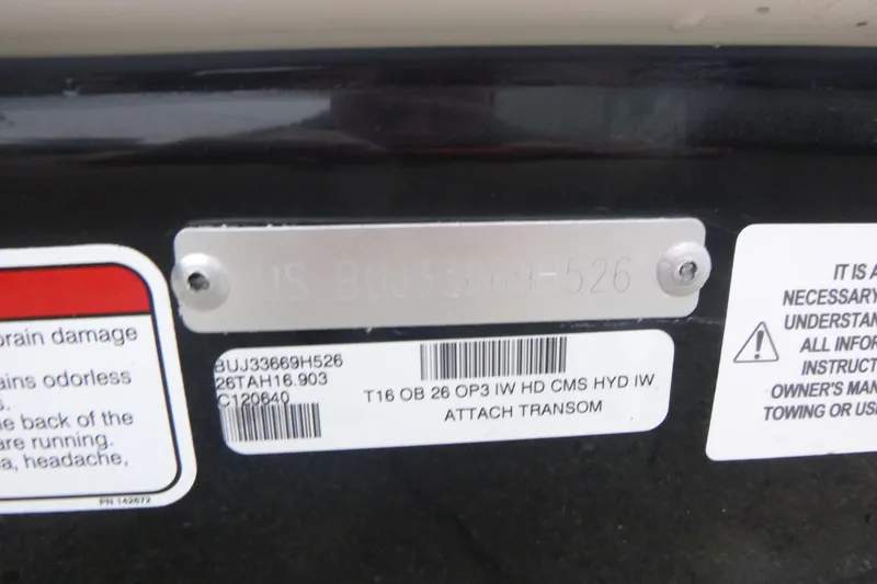 Slide: The Image of Serial number plate on a 2026 Tahoe T16 boat with warning labels. - 16