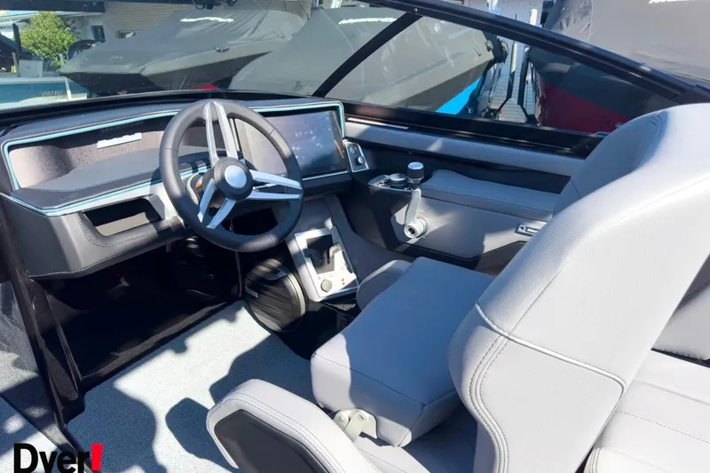 Slide: The Image of 2026 MasterCraft XT22 T boat interior with modern steering and dashboard design. - 10