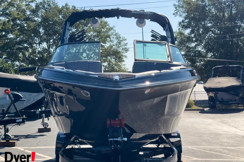 Slide: The Image of 2026 MasterCraft XT22 T boat displayed outdoors on a sunny day. - 4
