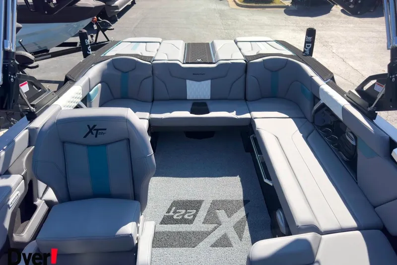 Slide: The Image of 2026 MasterCraft XT22 T boat interior with spacious seating and modern design. - 6