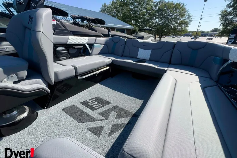 Slide: The Image of 2026 MasterCraft XT22 T boat interior with spacious seating and modern design. - 8