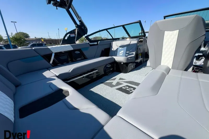 Slide: The Image of Interior of 2026 MasterCraft XT22 T boat with sleek gray seating and modern design. - 9