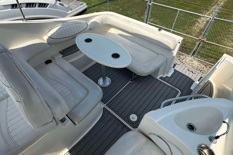Slide: The Image of 2000 Maxum 2700 SCR boat interior with seating and table, featuring sleek design and modern amenities. - 5
