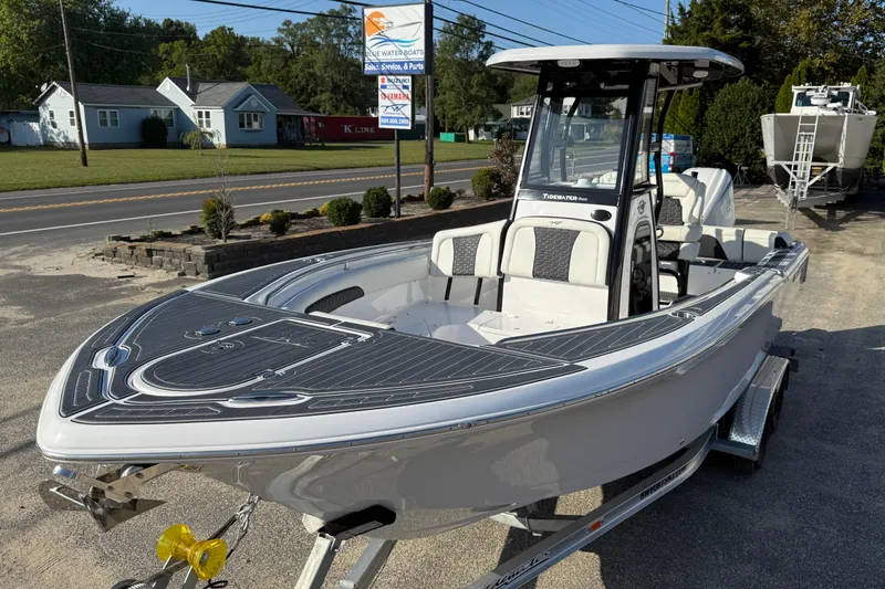 The Image of 2023 Tidewater 232 SS boat on trailer, displayed outdoors at a dealership. - 0