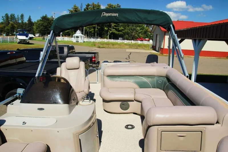 Slide: The Image of 2008 Premier 221 Cast-A-Way pontoon boat with beige seating and green canopy. - 10
