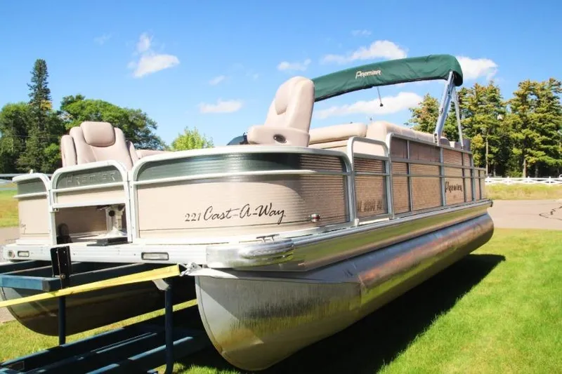 Slide: The Image of 2008 Premier 221 Cast-A-Way pontoon boat on grass, sunny day, green canopy. - 3