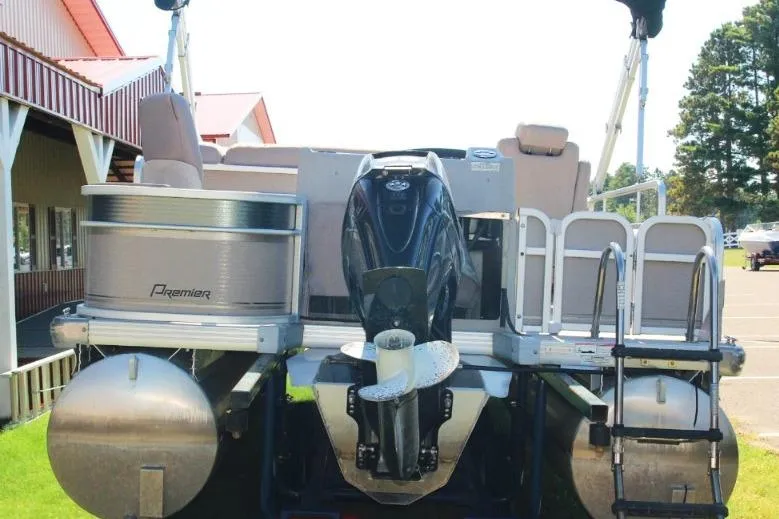 Slide: The Image of 2008 Premier 221 Cast-A-Way pontoon boat with outboard motor, docked outdoors. - 4