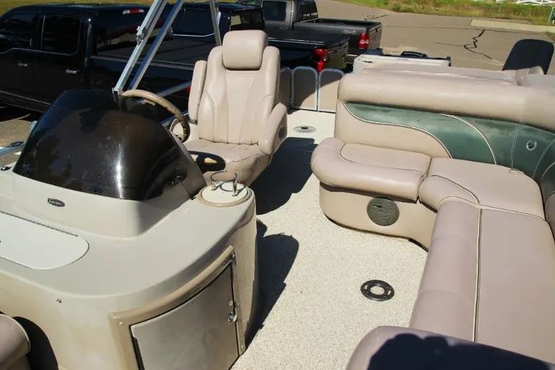 Slide: The Image of 2008 Premier 221 Cast-A-Way boat interior with beige seating and steering console. - 5