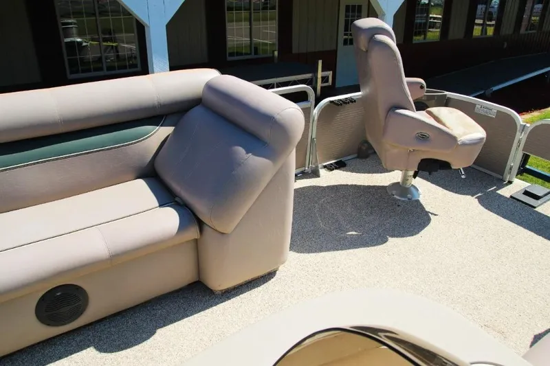 Slide: The Image of 2008 Premier 221 Cast-A-Way boat interior with beige seating and helm chair. - 7